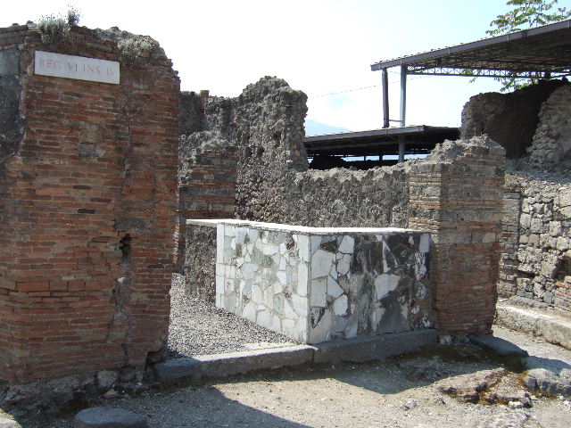 Left hand wall of VI.4.1 site of street shrine. December 2006. No longer visible.