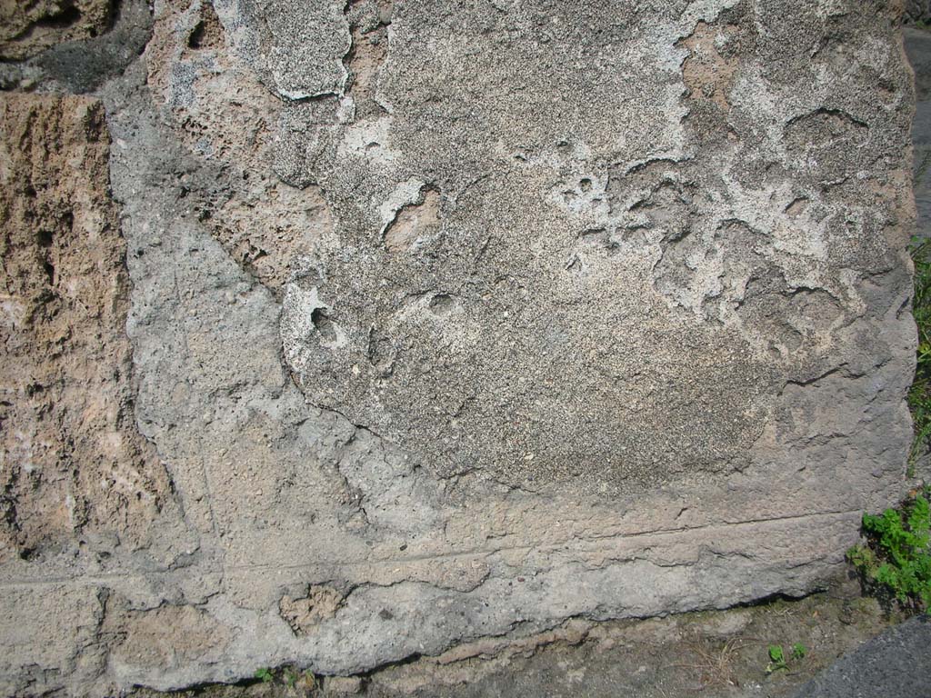 Porta Marina, Pompeii. May 2011. 
Detail of remaining plaster on lower pilaster on south side of pedestrian tunnel. Photo courtesy of Ivo van der Graaff.
