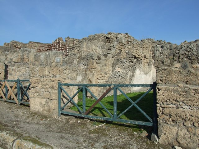 I.2.7 Pompeii. September 2010. North wall in north-west corner of shop, with doorway into I.2.7.Photo courtesy of Drew Baker.