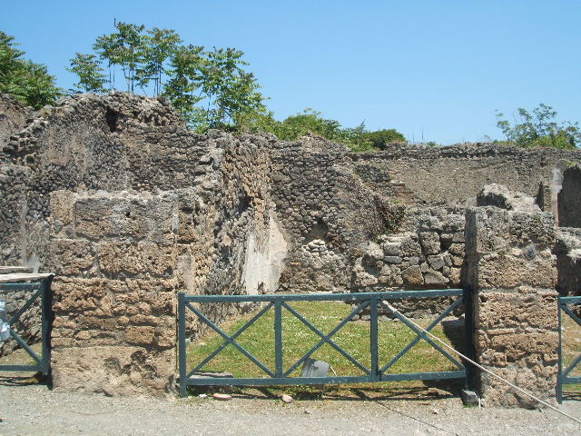 I.2.7 Pompeii. December 2007. North wall of shop and rear-room, against which would have been a wooden staircase in the rear room.