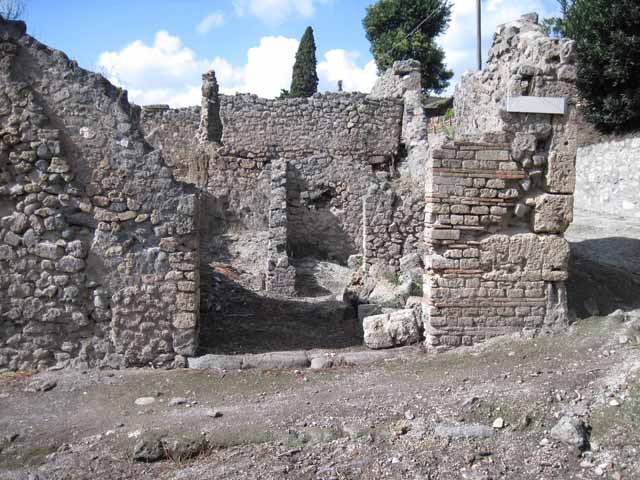 I.2.23 Pompeii. December 2006. Looking north towards small room (on right), and corridor (on left) leading to small kitchen area at rear of small room.