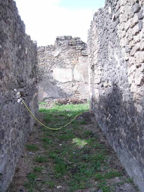 I.2.24 Pompeii. September 2010. Detail of upright brick column in atrium, looking west. Photo courtesy of Drew Baker.
