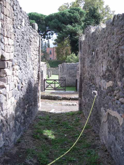 I.2.24 Pompeii. September 2010. North wall of atrium in north-west corner. Photo courtesy of Drew Baker.  According to Fiorelli, painted on the facing wall of the atrium was -
C . NONIVS . LORICA
P . INSTVLEIVS NEDYMVS         LIBRARI . QVI . C……
L . AELIVS . CYDINVS                  SVNT . HIC .SIN ……
ACILIVS . CEDRVS                       APPVLEI . ADIVTOR . ET…..      [CIL IV 3376]
See Pappalardo, U., 2001. La Descrizione di Pompei per Giuseppe Fiorelli (1875). Napoli: Massa Editore. (p.37)
According to Epigraphik-Datenbank Clauss/Slaby (See www.manfredclauss.de), it read –
C(aius) Nonius Lorica 
P(ublius) Instuleius Nedymus 
L(ucius) Aelius Cydinus 
Acilius Cedrus 
/ Librari qui C[3] 
sunt hic sine [3] 
Appulei adiutor et II[        (CIL IV 3376)

