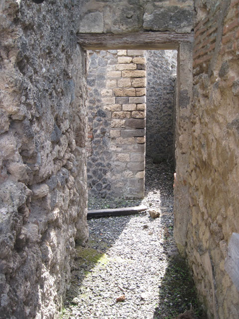 I.3.31 Pompeii. March 2009. Looking south along narrow corridor, or possible latrine.