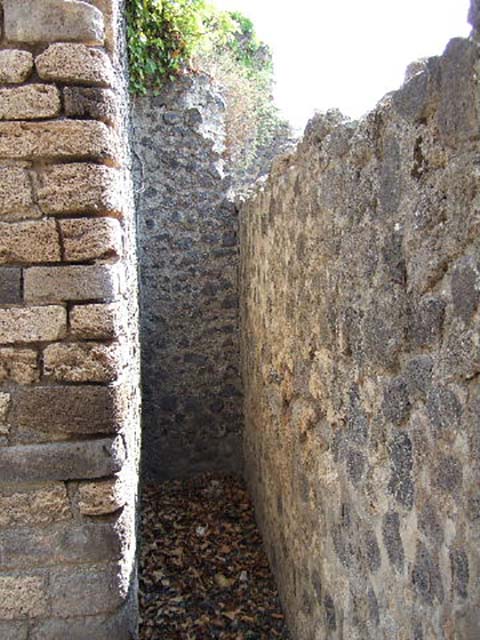 I.3.3 Pompeii. September 2010. Looking south through two doorways into kitchen area.
On the right, at the rear of the kitchen can be seen the entrance doorway at I.3.31.
Photo courtesy of Drew Baker.

