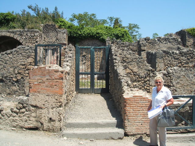 I.3.3 Pompeii. December 2007. Remains of altar to the household gods in the north-west corner of the atrium. This large masonry podium looked like the base of an aedicula, according to Boyce.
See Boyce G. K., 1937. Corpus of the Lararia of Pompeii. Rome: MAAR 14. (p.24)