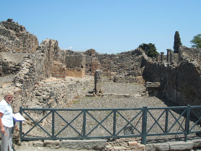 I.3.9 Pompeii. September 2010. South wall of entrance room and south-east corner.
This area would have been linked to area of I.3.10. On the left, the doorway to the first rear room can be seen. Photo courtesy of Drew Baker.