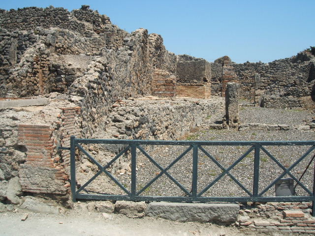 I.3.10 Pompeii. September 2010. Looking east towards doorway to the first rear room on the south side, and across room to the other rear rooms. Photo courtesy of Drew Baker.