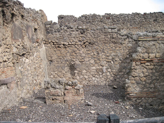 I.3.12 Pompeii.  Shop.  North wall and rear room in north east corner.