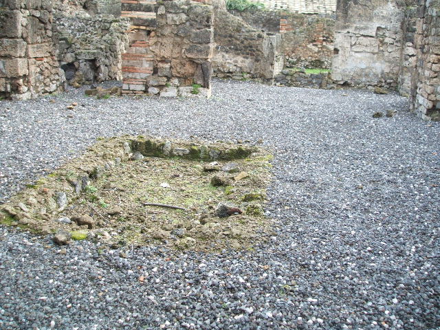 I.3.23 Pompeii. December 2006. Looking over wall into room to north of peristyle, from I.3.22