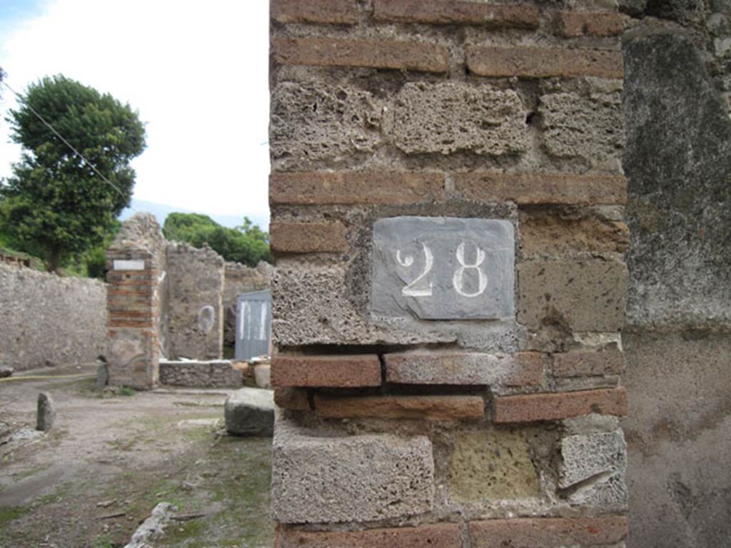I.3.28 Pompeii. September 2010. ID number plate on south side of entrance doorway. Photo courtesy of Drew Baker.