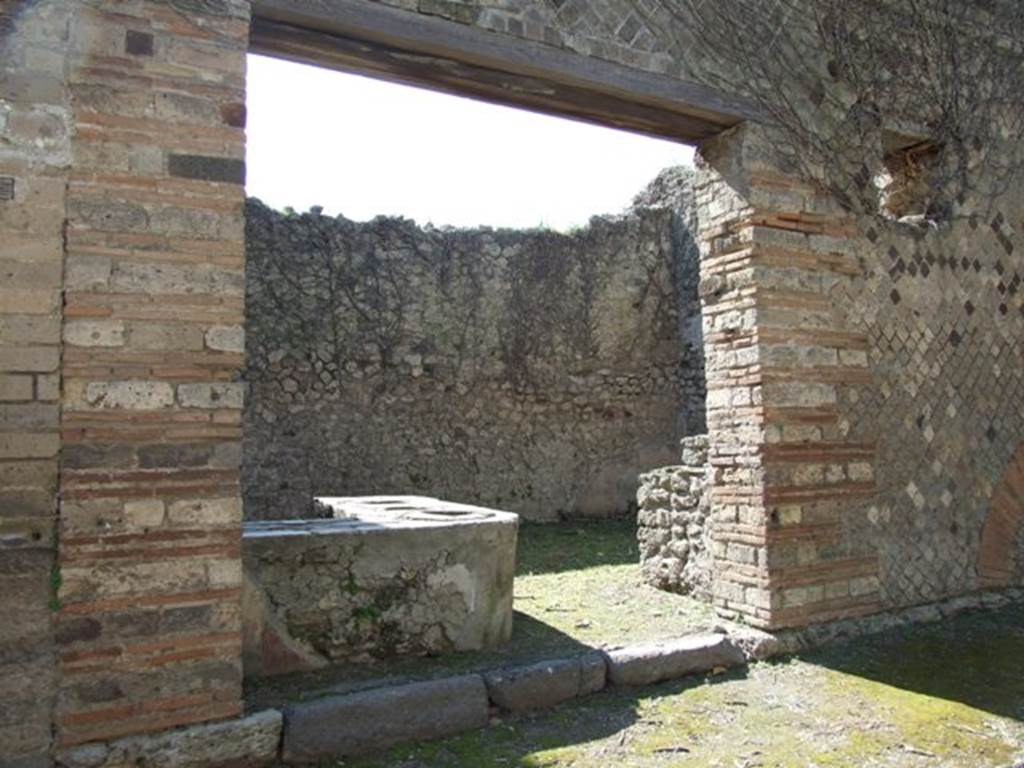 I.3.28 Pompeii. March 2009. Entrance doorway, looking west. According to Warscher, quoting Fiorelli, this spacious shop with a marble-topped podium, and a hearth to the right of the entrance. At the rear was another smaller hearth positioned under the wooden stairs that led to the upper floor.
See Warscher, T, 1935: Codex Topographicus Pompejanus, Regio I, 3: DAI, Rome.  

