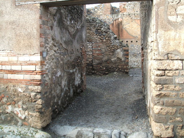 I.4.28 Pompeii. Domus of Q. Octavius Romulus. Room 5. Stables with drinking trough. East wall with windows on two floors.