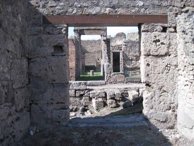 I.5.1 Pompeii. September 2010. Looking west from window in rear room, looking onto unnamed vicolo and west towards Via Stabiana. Photo courtesy of Drew Baker.