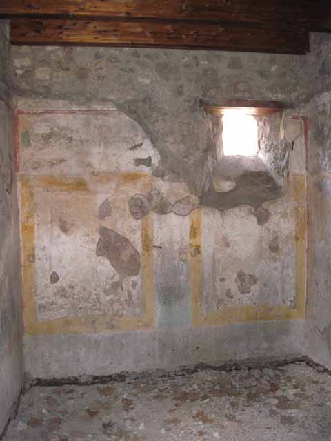 I.5.2 Pompeii. September 2010. North-east corner and east wall with fresco work. Photo courtesy of Drew Baker.