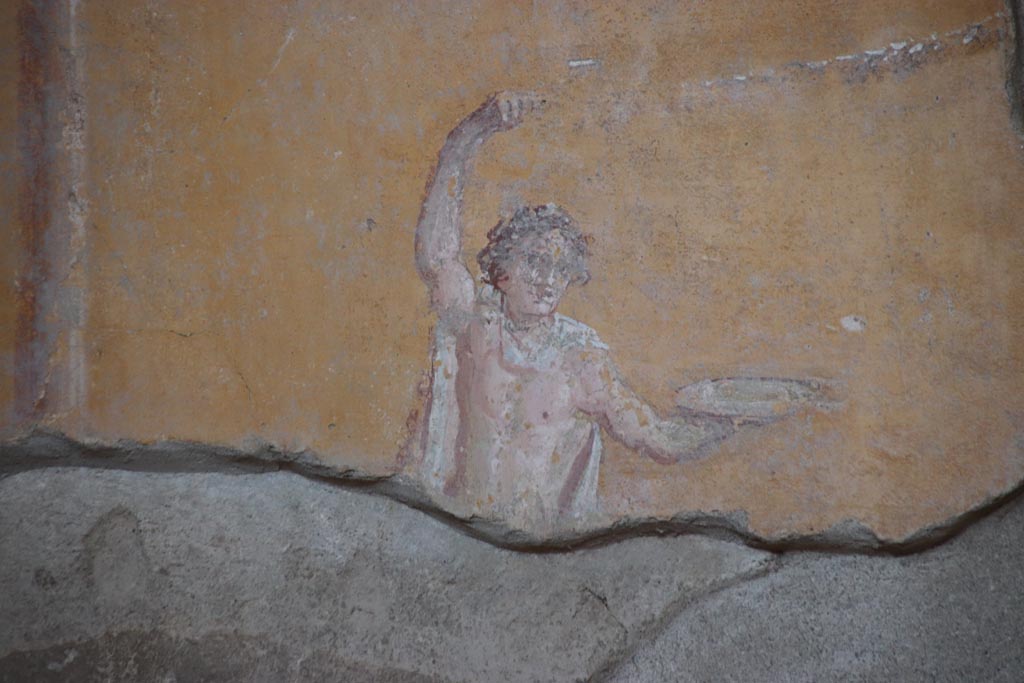 I.6.4 Pompeii. October 2022. Room 4, detail of painted figure at north end of upper east wall. Photo courtesy of Klaus Heese. 

