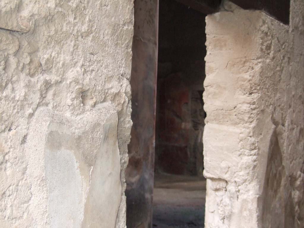 I.7.3 Pompeii. December 2005. Looking south-east from I.7.2, through door in wall to corridor, towards south-east corner of atrium.