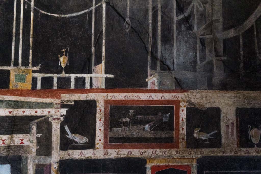 I.9.5 Pompeii. April 2022. 
Room 10, detail from upper west wall of triclinium on north side of central painting. Photo courtesy of Johannes Eber.
