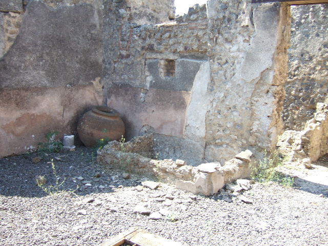 I.9.8 Pompeii. December 2006. Looking west at end of corridor, into small narrow rear room. According to Jashemski, this may originally have been a garden but by 79AD it was paved. See Jashemski, W. F., 1993. The Gardens of Pompeii, Volume II: Appendices. New York: Caratzas. (p.44)