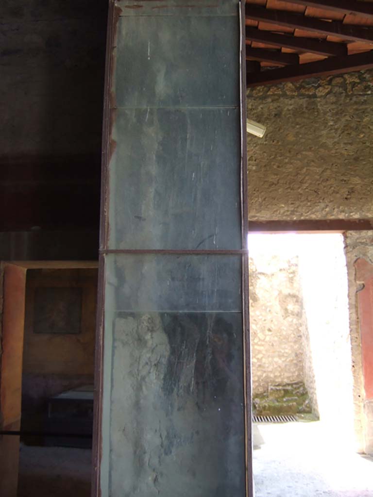 I.10.4 Pompeii. May 2006. Carbonised wood on door frame of room 18.