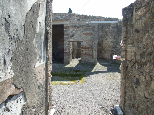 I.10.8 Pompeii.  December 2004.  Doorway to room 3 on east side of atrium.