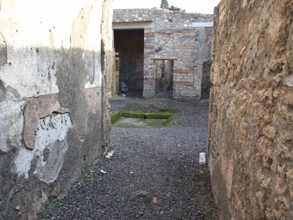 I.10.8 Pompeii. December 2007. Looking along fauces to atrium 1 and rear rooms 6, 7 and 8.
According to Wallace-Hadrill, this is possibly identified as a weaving establishment, on basis of loom weights and graffiti found.
A large range of domestic objects was also found here.
See Wallace-Hadrill, A. (1994). Houses and Society in Pompeii and Herculaneum. Princetown Univ. Press, (p.193)
For details of finds from this house,
See Allison, P.M. (2006). The Insula of the Menander at Pompeii: Vol. III The finds, Clarendon Press, Oxford, (p.214-230 & p.350-365).
See Online companion with list and photographs of finds from I.10.8

