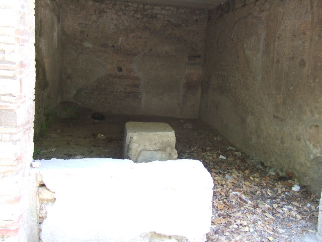 I.10.13 Pompeii. September 2005. Looking west across bar-room towards base of steps to upper floor, in south-west corner.