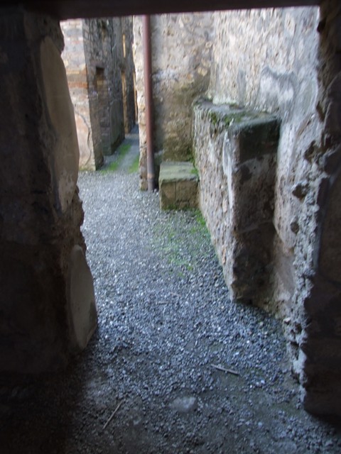I.10.15 Pompeii. December 2006. Corridor leading to I.10.15 from near stable, looking north past rooms.