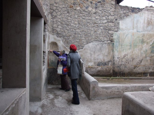 I.11.16. Casa di Saturninus. Hospitium. December 2007. Room 4. Corridor on south side of triclinium. At the far end is a door leading to a small alcove or staircase.