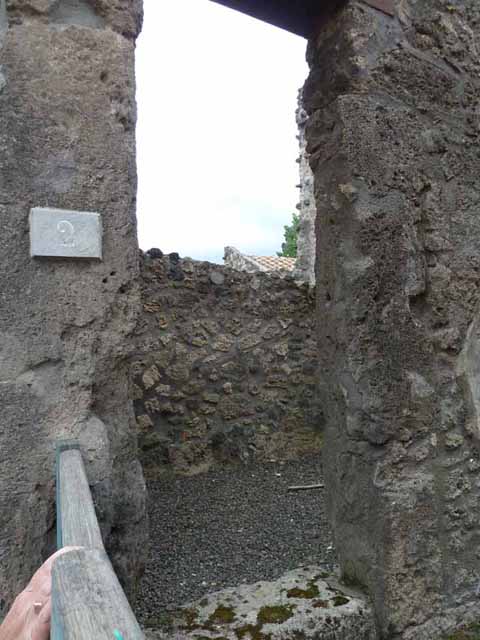 I.13.2 Pompeii. May 2010. West side of atrium, looking towards doorway to garden, and triclinium.