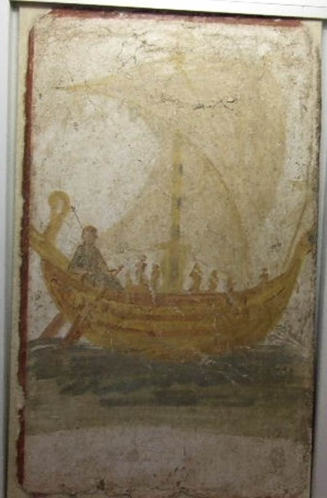 I.13.9 Pompeii. Venus on a boat, wall painting from exterior wall on south side of the entrance.   Photograph taken December 2006, Boscoreale Antiquarium. 
According to Varone, underneath the painting of a boat with open sails and Venus at the rudder acting a helmsman for the sailors, was a Greek inscription painted in black letters, saying Venus the Saviour. This was CIL IV 9867 but is no longer conserved.  See Varone, A., 2002. Erotica Pompeiana: Love Inscriptions on the Walls of Pompeii, Rome: Lerma di Bretschneider. (p.24)
According to Varone and Stefani, the inventory number of the painting should be 20697.  See Varone, A. and Stefani, G., 2009. Titulorum Pictorum Pompeianorum, Rome: Lerma di Bretschneider, (p.158)   According to Frohlich, the SAP inventory number was 2212-4.  See Frhlich, T., 1991. Lararien und Fassadenbilder in den Vesuvstdten. Mainz: von Zabern. (p.311, F.13, taf 17,10)

