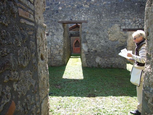 I.14.7 Pompeii.  March 2009. South east corner of atrium, with door to Cubiculum and corridor to rear.