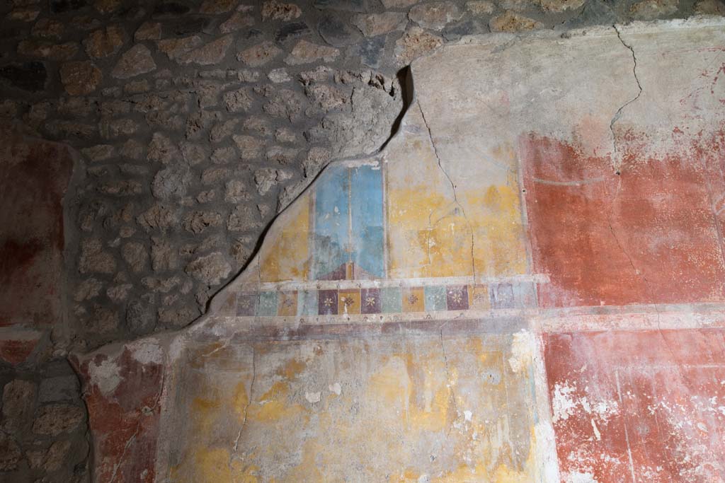I.14.15 Pompeii. January 2019. Detail of painted decoration from north wall of a room on north side of bar-room.
Photo courtesy of Johannes Eber.
