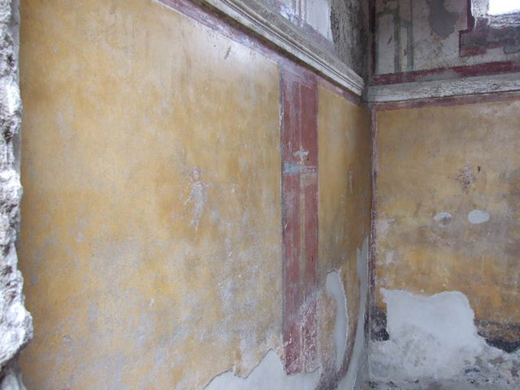 I.16.4 Pompeii. December 2006. Detail of painted wall and cornice on west wall of cubiculum.