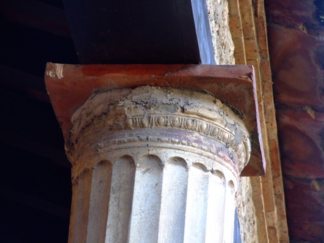 II.3.3 Pompeii.  March 2009.  Room 11, West Portico.  Painted decoration above Doorway to Room 13.