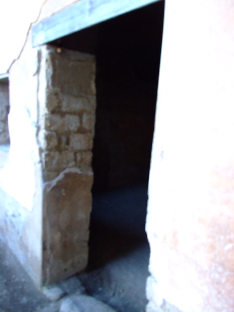 II.3.3 Pompeii.  March 2009.  Doorway to Room 14.