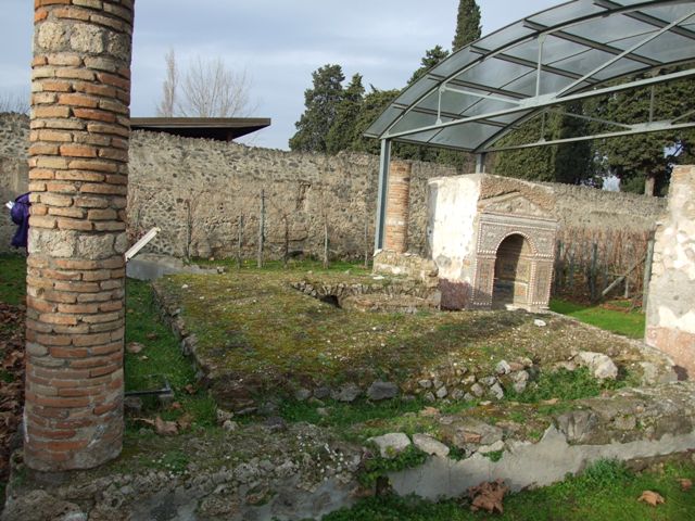 II.9.7. Garden entrance to House of Summer Triclinium. December 2007. Niches on north wall.