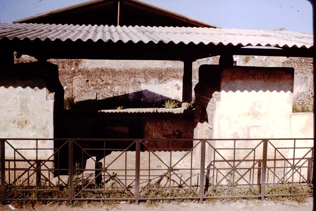 II.9.7. Garden entrance to House of Summer Triclinium.  December 2007.  Front mosaic face of fountain on north side.