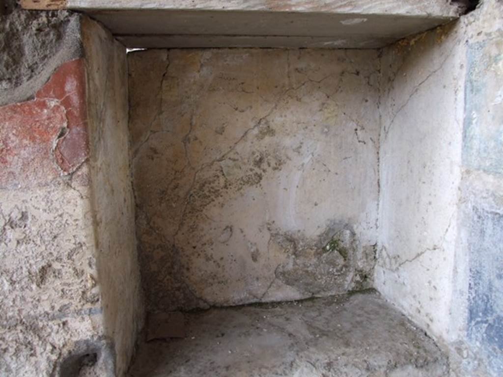 III.2.1 Pompeii.  March 2009.  Room 20.  Square recess or niche in west wall of Summer Triclinium.