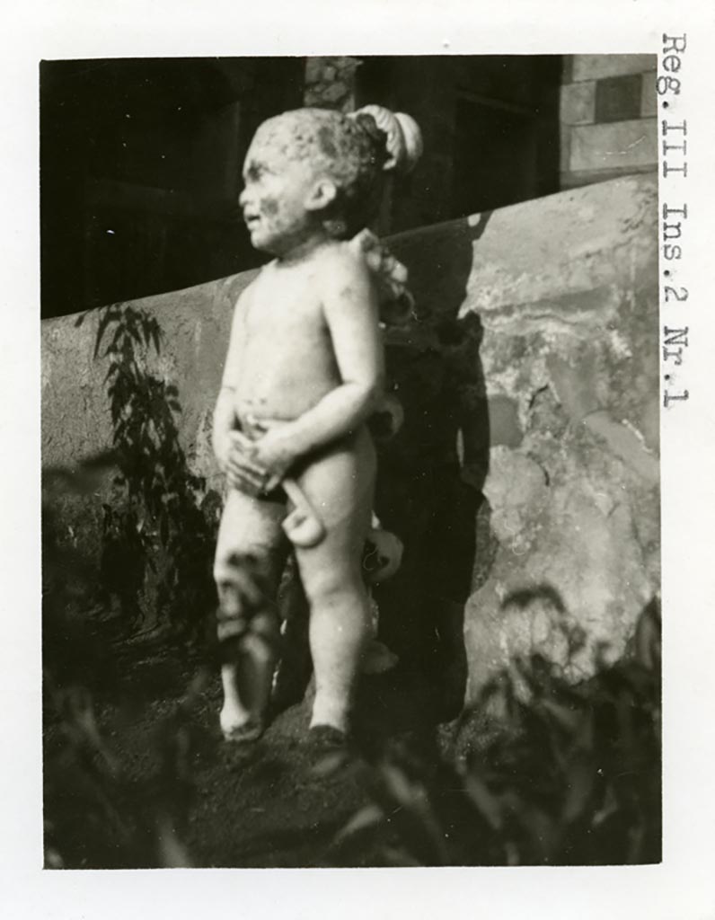 III.2.1 Pompeii. Pre-1937-39. Room 20, marble statuette of cupid.
Photo courtesy of American Academy in Rome, Photographic Archive. Warsher collection no. 1920.

