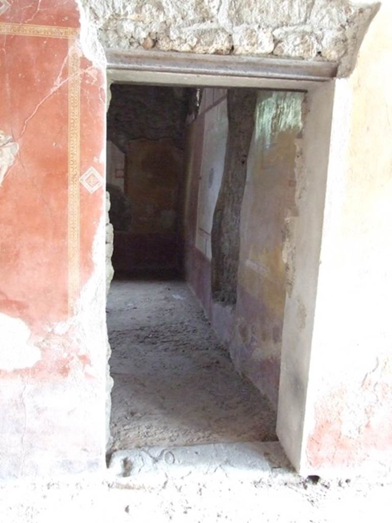 III.4.b. Pompeii.  March 2009.  Door to room 5, Triclinium., in east wall of room 4, Exedra.