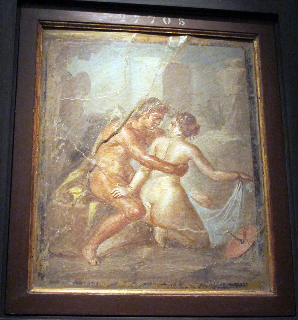 House on the Via degli Augustali, Pompeii. Painting of satyr embracing a nymph.
Now in Naples Archaeological Museum. Inventory number 27705.
According to PPM -
This painting has been wrongly attributed to the triclinium in the house at V.1.18, but the measurements and details described by Sogliano (So.238) do not add up.
The painting was identified as early as 1868, 6-7 years before the excavation of this house, by Helbig (H.554) as coming from a house on the Via degli Augustali. 
See Carratelli, G. P., 1990-2003. Pompei: Pitture e Mosaici: Vol. III. Roma: Istituto della enciclopedia italiana, p. 552, no.26.
