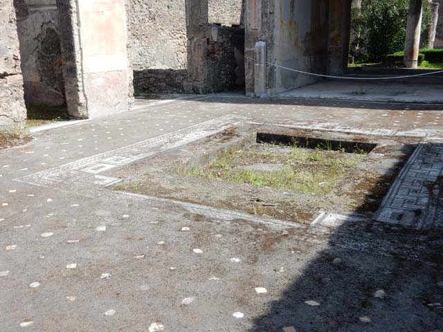 V.1.26 Pompeii. October 2020. Room 1, looking east across flooring in atrium, towards impluvium. Photo courtesy of Klaus Heese.