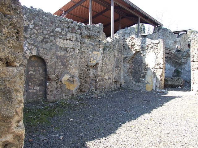 V.3.7 Pompeii. March 2009. Triclinium. East wall with door to passageway.