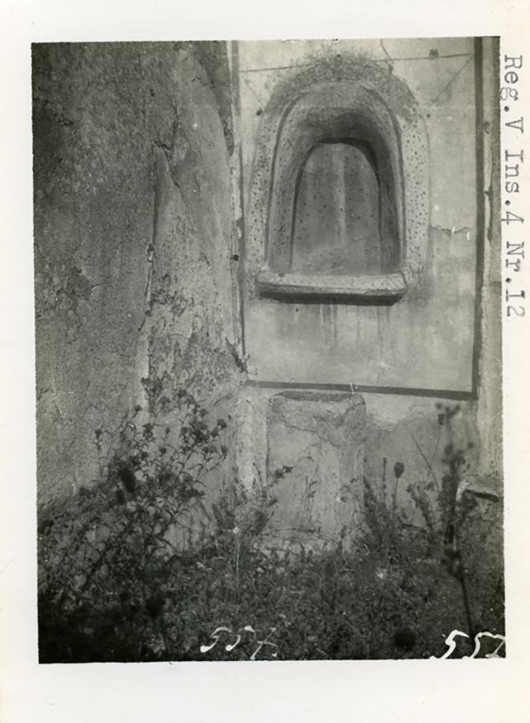 V.4.13 Pompeii but shown as V.4.12 on photo. Pre-1937. 
Looking towards lararium niche in north-west corner of garden area, and masonry altar.
Photo courtesy of American Academy in Rome, Photographic Archive. Warsher collection no. 557.
