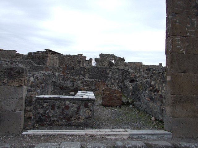 VI.1.17 Pompeii. December 2007. Looking to rear with room for the customers on left and corridor on the right leading to the latrine.