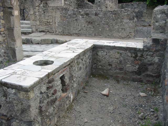 VI.1.17 Pompeii. May 2010. Kitchen and latrine in rear north-east corner.