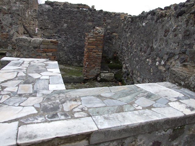 VI.1.18 Pompeii. May 2010. Kitchen and latrine, on north side of entrance at VI.1.20.