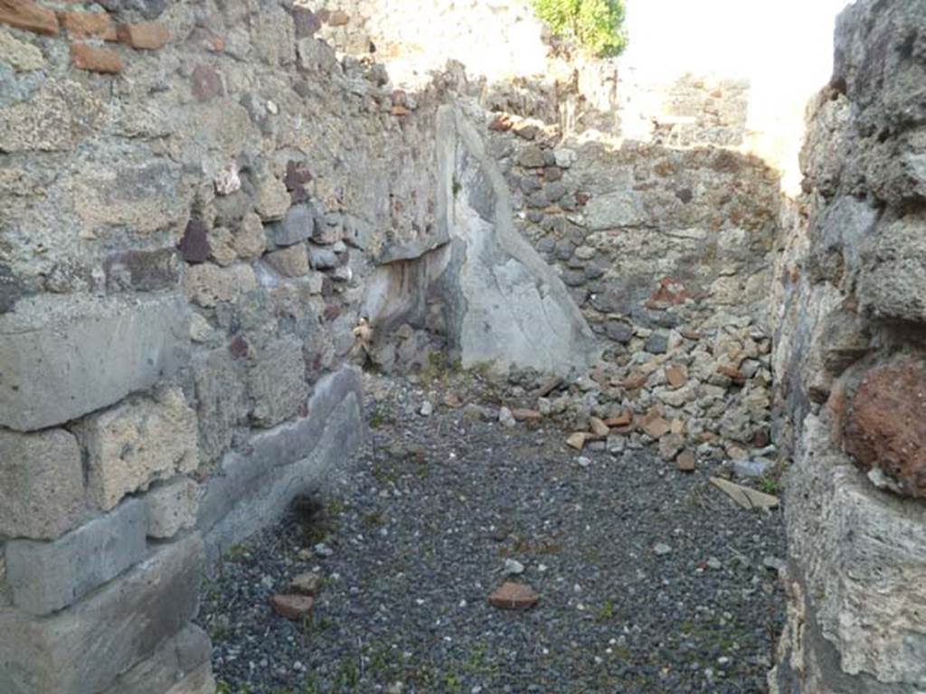 VI.2.26 Pompeii. May 2011. Looking east into cubiculum on east side of yard.