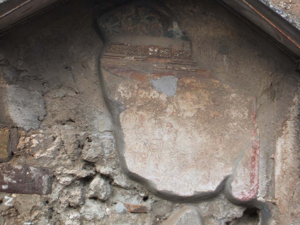 VI.4.4 Pompeii. December 2004. North wall, with remains of painted lararium shrine.